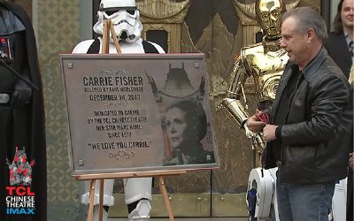 Todd Fisher accepts a bronze memorial plaque honoring his sister, StarWars actor Carrie Fisher.